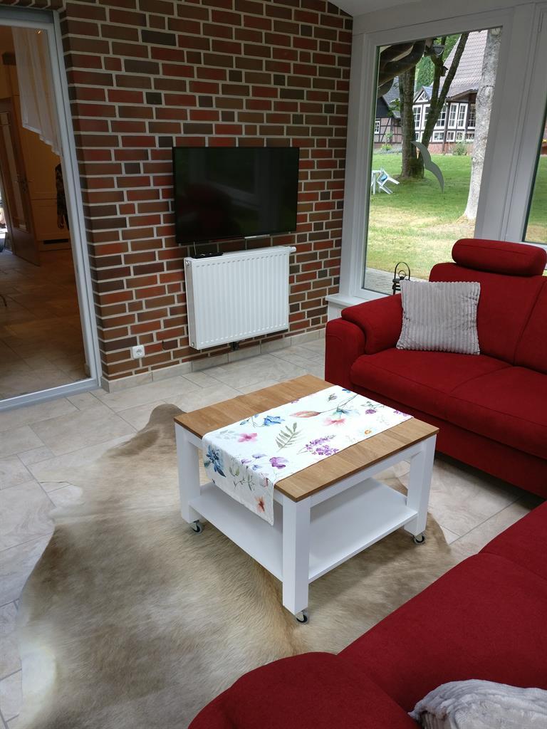 Wohnzimmer mit Fernseher Ferienhaus