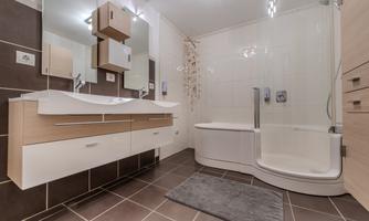 A modern bathroom with a shower and a bathtub. Bright colors and stylish design create an inviting atmosphere.