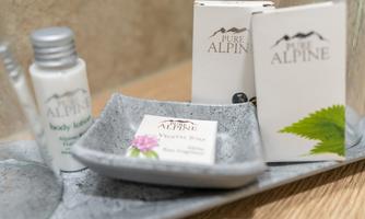 A selection of care products in a bathroom. The items are nicely arranged in neutral packaging.