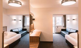A modern room with two beds and a sofa. Bright walls and a large window provide plenty of light.