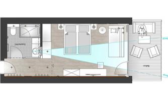 A floor plan of a modern living space with a bedroom, bathroom, and a small outdoor area. The rooms are clearly structured and well arranged.