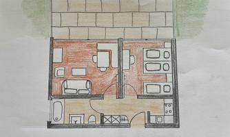 A floor plan of a ground floor apartment for a maximum of five people. It shows the living room, bedroom, and a garden terrace with a view of the mountains.