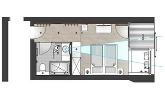 A layout of a modern room with two beds, a bathroom, and a living area. The view shows an efficient use of space with clear lines and room division.