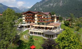 A pleasant hotel in a quiet setting with green gardens and views of the mountains. The terrace invites you to relax.