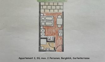 A floor plan of an apartment for two people with a mountain view and garden terrace. The plan shows the arrangement of rooms and furniture.