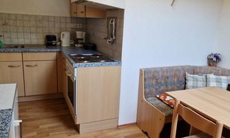 Living kitchen with seating area and television