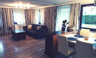 A bright living room with a cozy sofa and a dining area. Large windows provide plenty of light and a pleasant atmosphere.