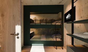A modern room with bunk beds and minimalist design. The walls are in dark colors, and there is a television as well as shelves.