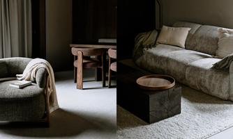 A stylish living room with a cozy armchair and a modern sofa. The soft color shades create a relaxed atmosphere.