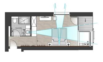 The image shows a floor plan of an apartment with a bathroom, a living area, and a terrace. The rooms are clearly structured and well arranged.