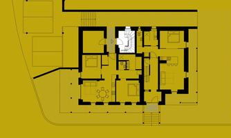 A floor plan with various rooms and a central staircase. The drawing has a yellow background color and shows clear lines and dimensions.