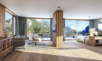 A modern room with large windows that offer a view of the mountains. The decor is minimalist and made from natural materials.