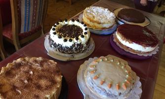 A selection of delicious cakes is on a table. The cakes are colorfully decorated and invite you to enjoy.