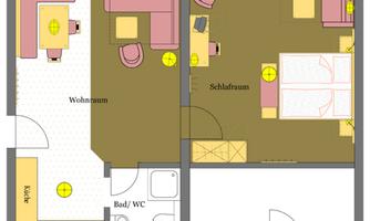 An apartment floor plan drawing with two rooms. The living area and bedroom are depicted, as well as a kitchen and a bathroom.