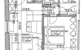 A floor plan sketch of an apartment with several rooms, including a bedroom and a living room. It also shows a balcony on the south side.