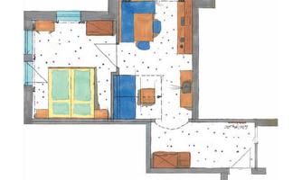 A floor plan of an apartment with an open living area, a kitchen, and a bedroom. The rooms are color-coded and show the arrangement of furniture.