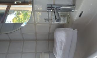 Bathroom with sink and white towels.