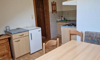Living kitchen with seating area and television
