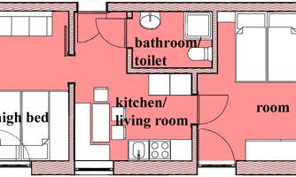 An apartment floor plan with a bathroom, a kitchen/living room, and two separate sleeping areas. It shows the arrangement of the rooms and furniture.