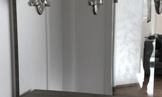 A modern interior with a large mirror. Two silver antlers are挂 on the wall.