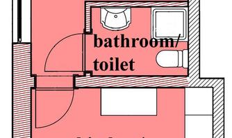 A floor plan of an apartment with one bedroom, one bathroom, and a living/kitchen area. The rooms are highlighted in color and labeled.