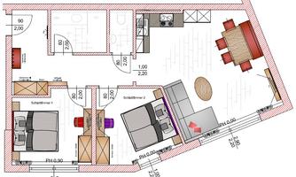 A floor plan of an apartment with two bedrooms, a living room, and a kitchenette. The dining area is depicted with a round table and chairs.