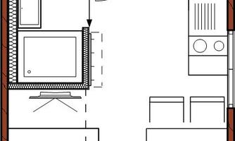 A floor plan drawing of an apartment. It shows an open living area with kitchen, dining area, and bathroom.