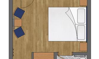 A floor plan drawing of a room with a balcony. The room contains a bed, chairs, and a bathroom with a shower and toilet.