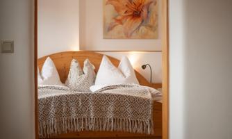 A cozy bedroom with a large bed.