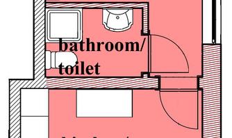 An apartment floor plan with two rooms. The ground floor shows a kitchen/living room and a bathroom with a toilet.