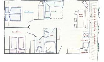 A floor plan of an apartment with two bedrooms, a living room, and a bathroom. The kitchen is also drawn in, along with furniture such as a sofa and a dining table.