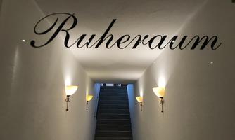 A quiet corridor with the label "Rest Room" on the wall. Soft lighting and steps lead upwards.