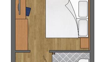 A schematic representation of a room with two beds, a table, and a seating area. At the bottom, there are a bathroom and a separate toilet.