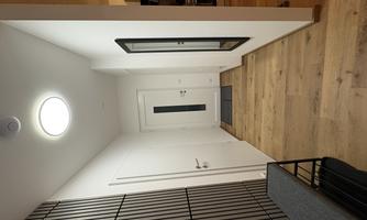 A modern hallway with wooden flooring and white walls. On the left side, there is a wardrobe and a mirror.