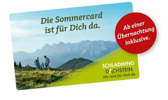A card with the text "The Summer Card is here for you" and a beautiful mountain panorama in the background. In the foreground, two hikers can be seen enjoying the view.