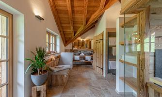 A modern wellness area with wooden elements and large windows. The cozy atmosphere invites relaxation.