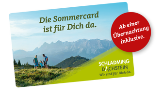 A picturesque mountain landscape with people enjoying the view. The Summer Card offers benefits for guests in the Schladming-Dachstein region.