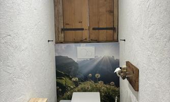 Separates restroom, left next to bathroom