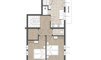A clear floor plan drawing of an apartment. The rooms are well arranged, with a balcony on the right side.