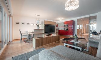 Modern living kitchen with an open layout.  
Bright colors and stylish furniture create an inviting atmosphere.