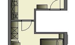 A clear apartment floor plan with two bedrooms, a living room, and a kitchen. The design is functional and includes various areas for living and dining purposes.
