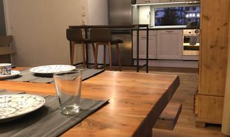 A modern dining room with a large wooden table and dishes. In the background, there is a well-equipped kitchen.