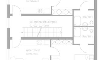 A floor plan of a house with various rooms. The plan shows a bedroom, a bathroom, and a spacious living area.