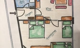 A floor plan with two bedrooms, a kitchen, and a bathroom. The rooms are color-coded and labeled.