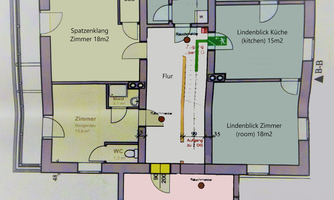 A floor plan of an apartment with several rooms. The areas are labeled and include a bathroom, a kitchen, and various bedrooms.