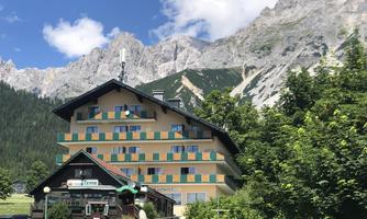 A charming hotel surrounded by mountains and nature. The fresh air and picturesque landscape invite relaxation.