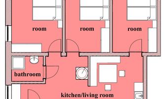 An apartment floor plan with three rooms, a kitchen/living room, and a bathroom. The floor plan also shows a separate WC.