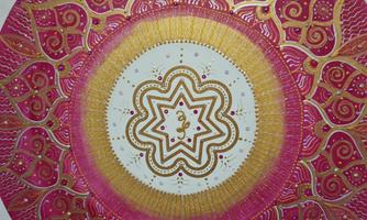 An artistic mandala with colorful patterns in pink, gold, and white. The symmetrical design draws the eye to the center of the image.