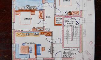 A colored floor plan sketch of an apartment with several rooms, a living kitchen, and a bathroom. The plan includes notes on a ski room and cabin.