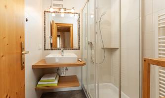 In the Hochwurzen apartment, there are two separate bathrooms.  
Both have their own shower.